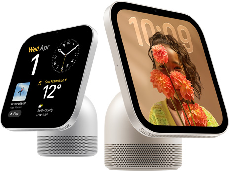 Apple HomeView, two devices: silver colour, first screen shows date, clock and weather, starlight colour (pale gold), second screen shows time over a wallpaper of a person holding flowers