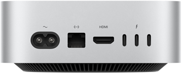 Mac mini, aizmugure, strāvas ligzda, Ethernet ports, HDMI ports, trīs Thunderbolt porti