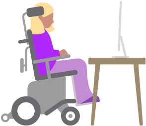 Une personne en fauteuil roulant motorisé regarde un ordinateur Mac sur un bureau