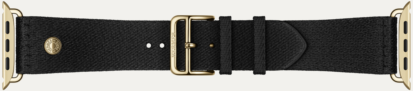Detalle de la correa Clou de Selle Satiné color Noir para el Apple Watch Hermès Series 12, con suave tejido satinado negro y componentes en color oro radiante