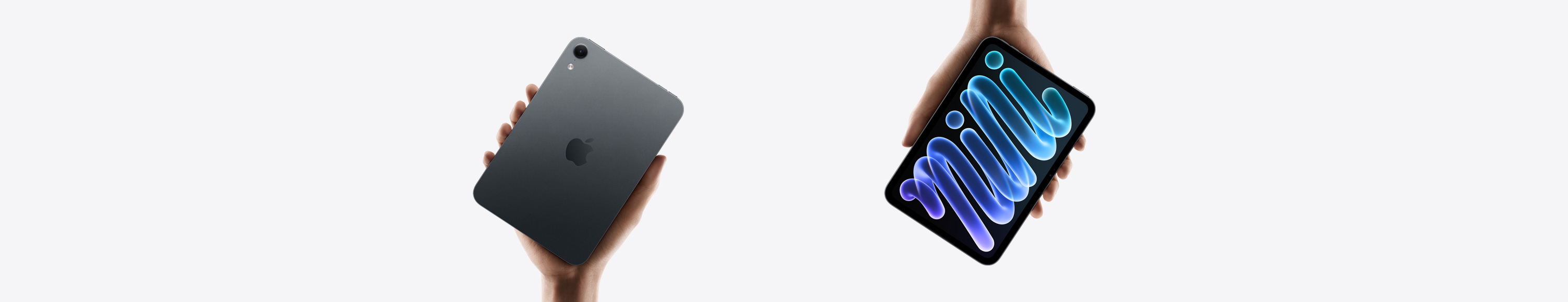 iPad mini, held in hand.