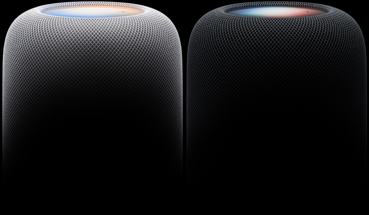 Twee HomePod-speakers naast elkaar, in de kleuren wit en middernacht, geweven akoestisch mest-materiaal, verlichte touch-oppervlakken