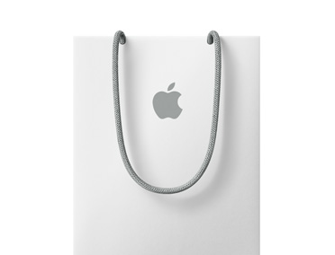白色 Apple 購物袋，近袋口上方有 Apple 標誌。