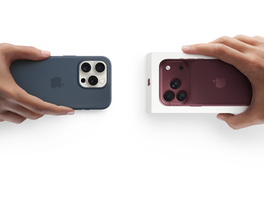 Hand met een inruil-iPhone 13 in een siliconenhoesje met stickers op de achterkant, die wordt ingeruild voor een nieuwe iPhone 18 Pro in de verpakking.