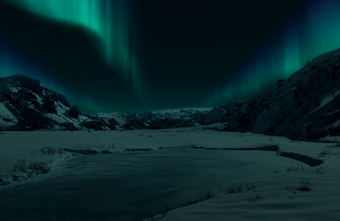 Vue de l’Apple Vision Pro d’un environnement islandais, montagnes enneigées et aurore boréale sur fond sombre